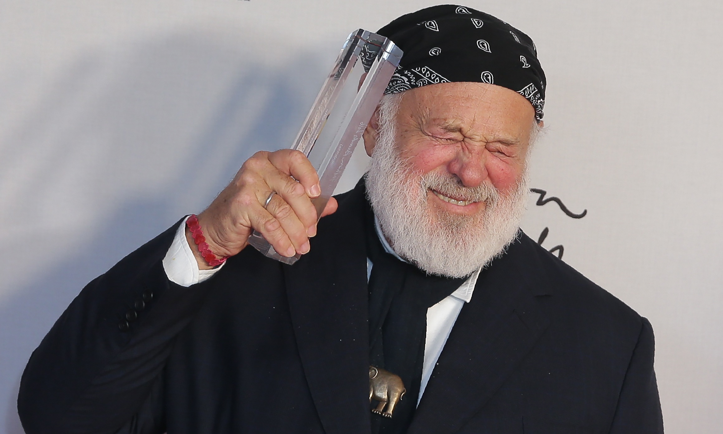 Photographer Bruce Weber poses with his award after being named winner of the Isabella Blow Award for Fashion Creator award.
