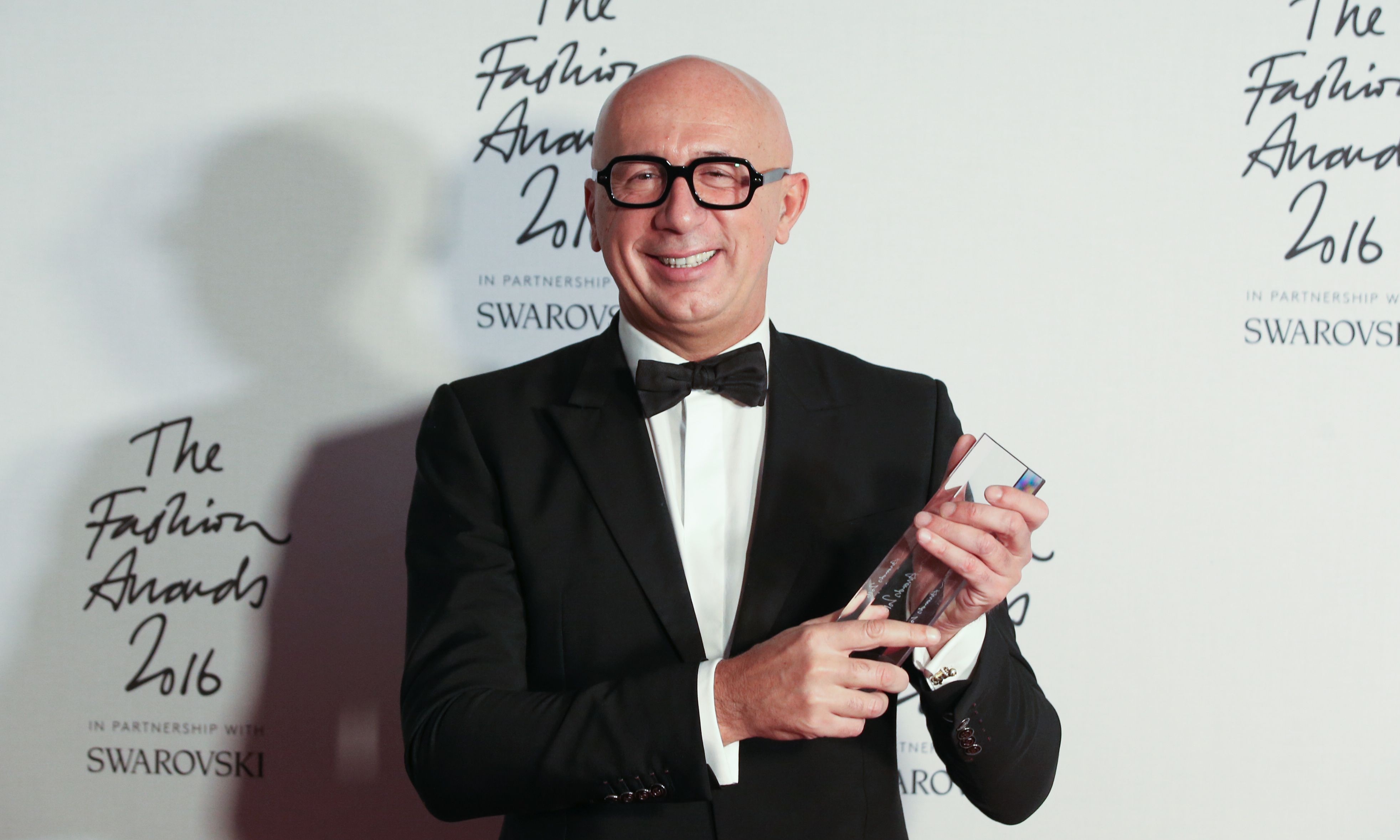 President and CEO of Gucci, Marco Bizzarri, poses with his award after being named winner of the International Business Leader award.